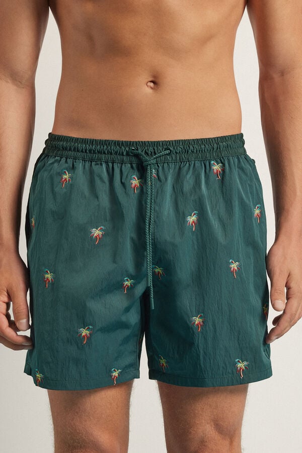 Short de bain avec broderie palmes